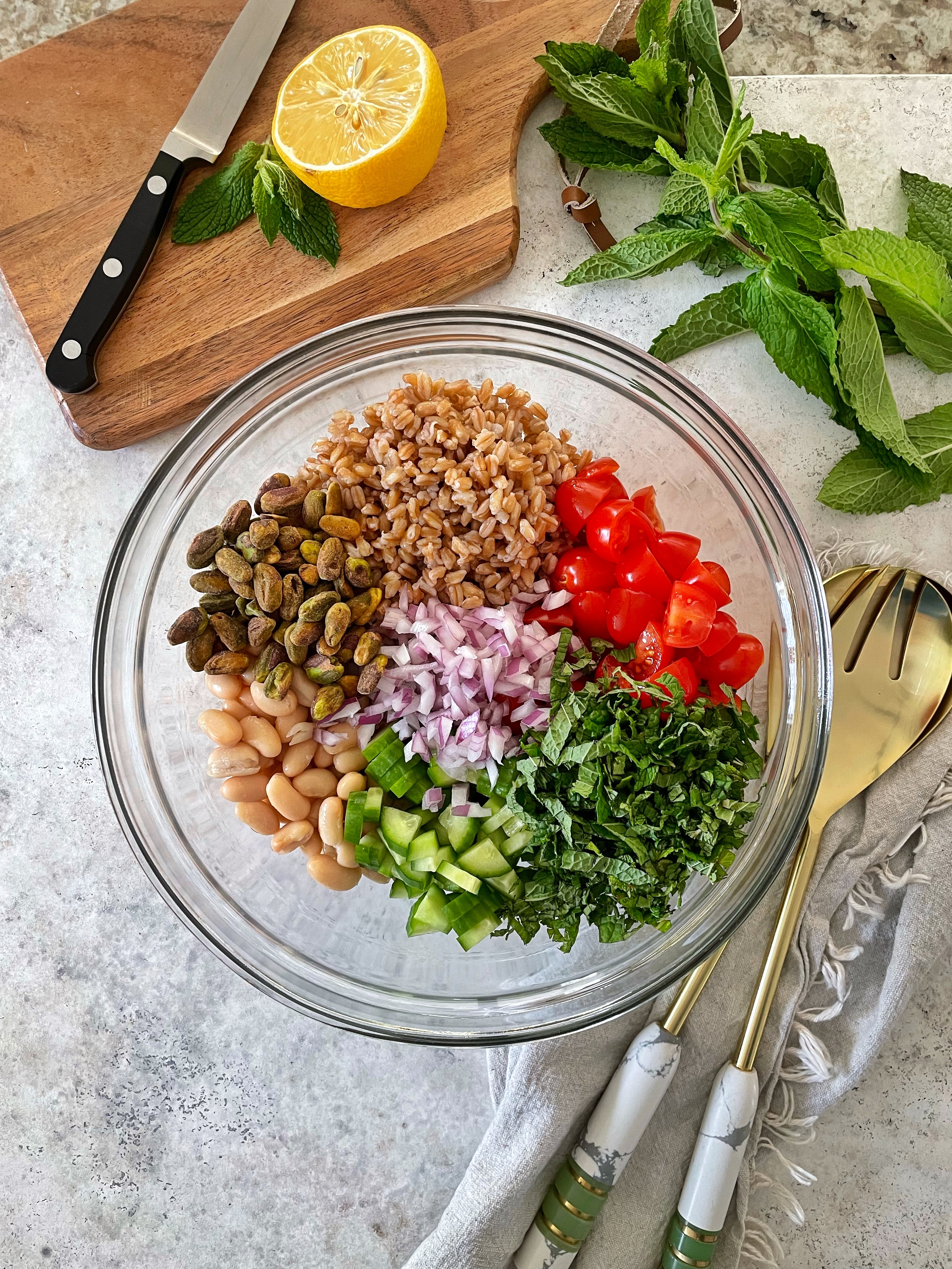 Assembled bowl of salad ingredients with no dressing